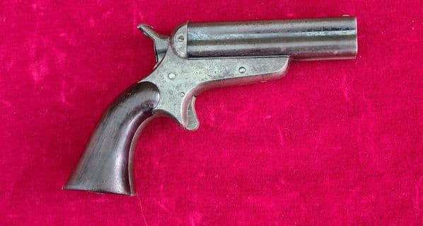 A fine  example of a SHARPS four barrelled .32 cal rim-fire derringer. Circa 1865. Ref 3839.